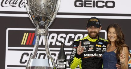 AVONDALE, ARIZONA - NOVEMBER 05: Ryan Blaney, driver of the #12 Menards/Dutch Boy Ford, and Gianna Tulio pose for photos in victory lane after winning the 2023 NASCAR Cup Series Championship, finishing first of the Championship 4 drivers in the NASCAR Cup Series Championship race at Phoenix Raceway on November 05, 2023 in Avondale, Arizona. (Photo by Sean Gardner/Getty Images) | Getty Images