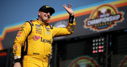 AVONDALE, ARIZONA - NOVEMBER 05: Michael McDowell, driver of the #34 Love's/Delo Ford, waves to fans as he walks onstage during driver intros prior to the NASCAR Cup Series Championship at Phoenix Raceway on November 05, 2023 in Avondale, Arizona. (Photo by Jared C. Tilton/Getty Images) | Getty Images
