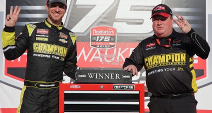 WEST ALLIS, WISCONSIN - AUGUST 27: Grant Enfinger, driver of the #23 Champion Power Equipment Chevrolet, and crew chief Jeff Hensley celebrate in victory lane after winning the NASCAR Craftsman Truck Series Clean Harbors 175 at The Milwaukee Mile on August 27, 2023 in West Allis, Wisconsin. (Photo by Jonathan Bachman/Getty Images) | Getty Images