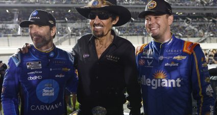 DAYTONA BEACH, FLORIDA - FEBRUARY 16: Legacy Motor Club team owners, Jimmie Johnson, driver of the #84 Carvana Chevrolet, (L) and NASCAR Hall of Famer Richard Petty (C) pose for photos with Erik Jones, driver of the #43 GUNS N' ROSES Chevrolet, prior to the NASCAR Cup Series Bluegreen Vacations Duel #1 at Daytona International Speedway on February 16, 2023 in Daytona Beach, Florida. (Photo by Chris Graythen/Getty Images) | Getty Images