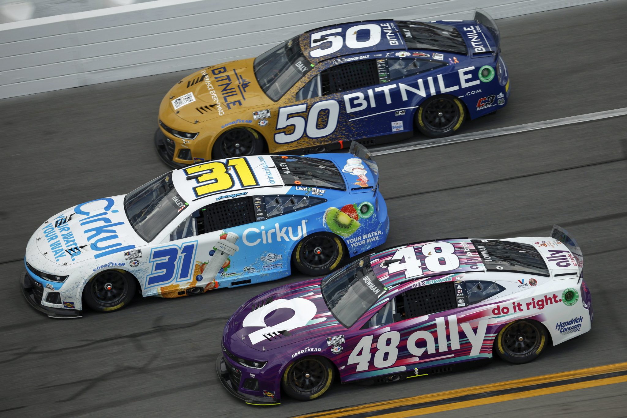 DAYTONA BEACH, FLORIDA - FEBRUARY 19: Alex Bowman, driver of the #48 Ally Chevrolet, Justin Haley, driver of the #31 Cirkul Chevrolet, and Conor Daly, driver of the #50 BitNile.com Chevrolet, race during the NASCAR Cup Series 65th Annual Daytona 500 at Daytona International Speedway on February 19, 2023 in Daytona Beach, Florida. (Photo by Jared C. Tilton/Getty Images) | Getty Images