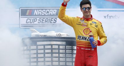 DAYTONA BEACH, FLORIDA - FEBRUARY 19: Joey Logano, driver of the #22 Shell Pennzoil Ford, waves to fans as he walks onstage during driver intros prior to the NASCAR Cup Series 65th Annual Daytona 500 at Daytona International Speedway on February 19, 2023 in Daytona Beach, Florida. (Photo by Jared C. Tilton/Getty Images) | Getty Images