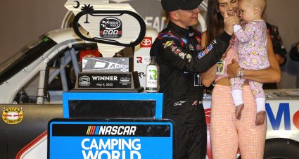 DARLINGTON, SOUTH CAROLINA - MAY 06: John Hunter Nemechek, driver of the #4 Mobil 1 Toyota, celebrates in victory lane with his wife, Taylor, and daughter Aspen Palmer after winning the NASCAR Camping World Truck Series Dead on Tools 200 at Darlington Raceway on May 06, 2022 in Darlington, South Carolina. (Photo by James Gilbert/Getty Images) | Getty Images