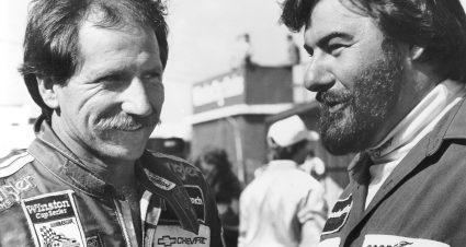 1980s:  Driver Dale Earnhardt (L) and Richard Childress Racing gasman Danny ÒChocolateÓ Myers share a moment at a NASCAR Cup race in the 1980s. (Photo by ISC Images & Archives via Getty Images)