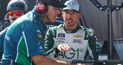 CONCORD, NORTH CAROLINA - OCTOBER 08: Daniel Hemric, driver of the #11 AG1 - Athletic Greens Chevrolet, and crew chief Jason Trinchere talk on the grid during practice for the NASCAR Xfinity Series Drive for the Cure 250 presented by BlueCross BlueShield of North Carolina at Charlotte Motor Speedway on October 08, 2022 in Concord, North Carolina. (Photo by Mike Mulholland/Getty Images) | Getty Images