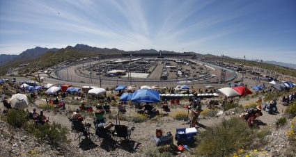 AVONDALE, ARIZONA - MARCH 12: NASCAR fans look on from the hillside area during the NASCAR Cup Series United Rentals Work United 500 at Phoenix Raceway on March 12, 2023 in Avondale, Arizona. (Photo by Chris Graythen/Getty Images) | Getty Images