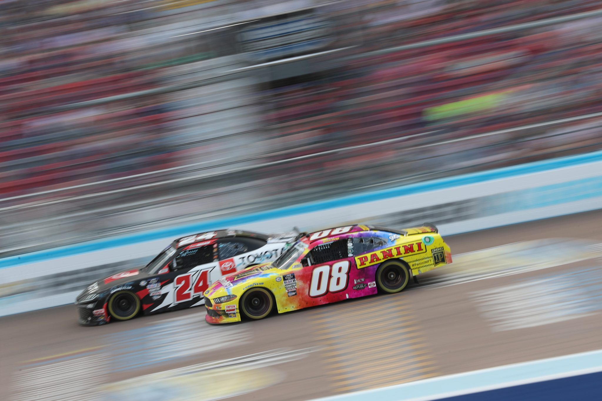 AVONDALE, ARIZONA - MARCH 11: Connor Mosack, driver of the #24 Toyota Racing Development Toyota, and Gray Gaulding, driver of the #08 Panini NFT Ford, race during the NASCAR Xfinity Series United Rentals 200 at Phoenix Raceway on March 11, 2023 in Avondale, Arizona. (Photo by Meg Oliphant/Getty Images) | Getty Images