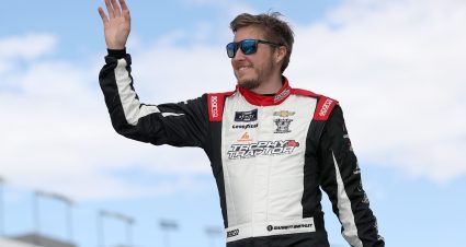 LAS VEGAS, NEVADA - MARCH 04: Garrett Smithley, driver of the #99 PCARx Chevrolet, waves to fans as he walks onstage during driver intros prior to the NASCAR Xfinity Series Alsco Uniforms 300 at Las Vegas Motor Speedway on March 04, 2023 in Las Vegas, Nevada. (Photo by Meg Oliphant/Getty Images) | Getty Images