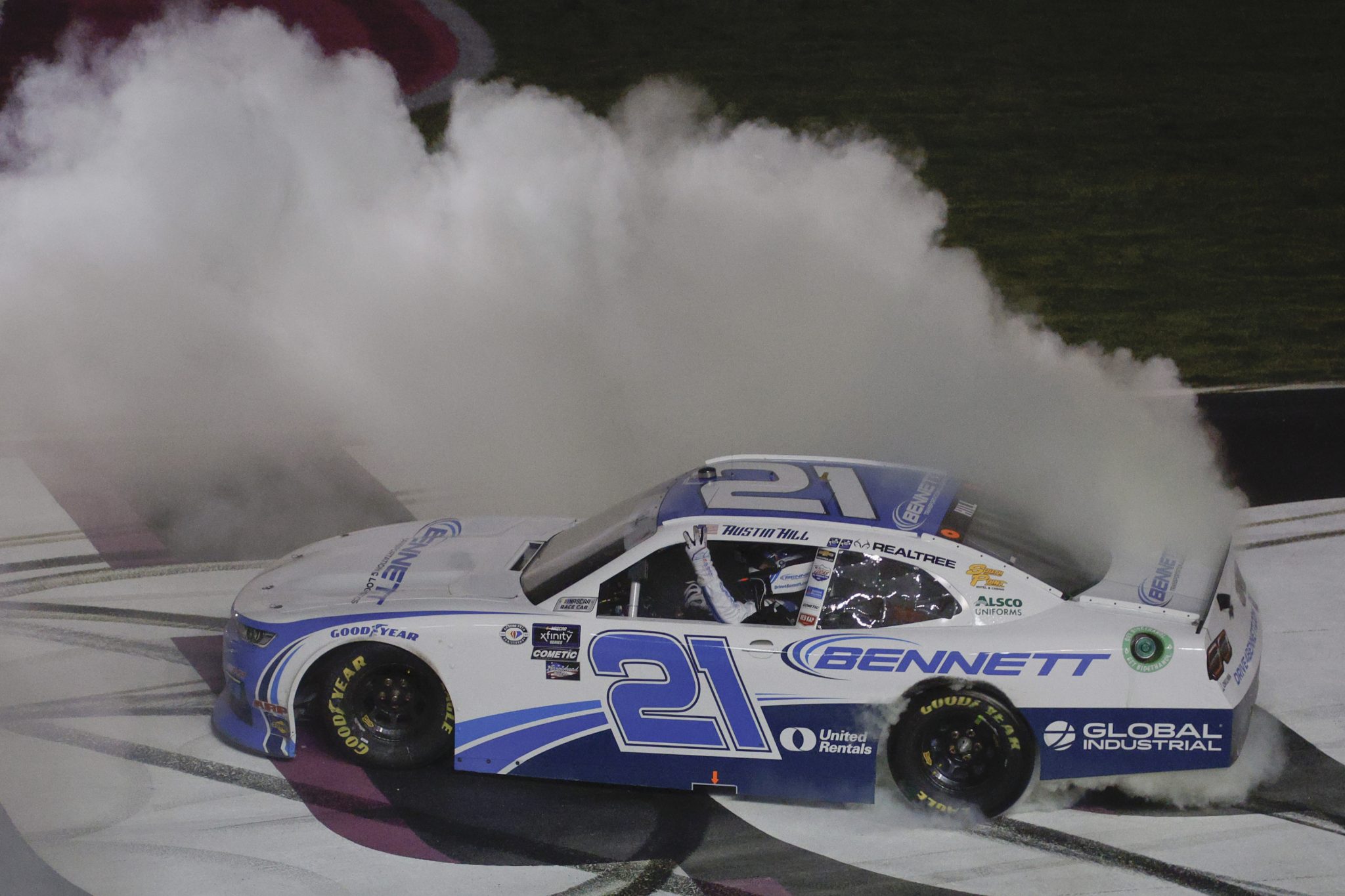 HAMPTON, GEORGIA - MARCH 18: Austin Hill, driver of the #21 Bennett Transportation Chevrolet, celebrates with a burnout after winning the NASCAR Xfinity Series RAPTOR 250 at Atlanta Motor Speedway on March 18, 2023 in Hampton, Georgia. (Photo by Sean Gardner/Getty Images) | Getty Images