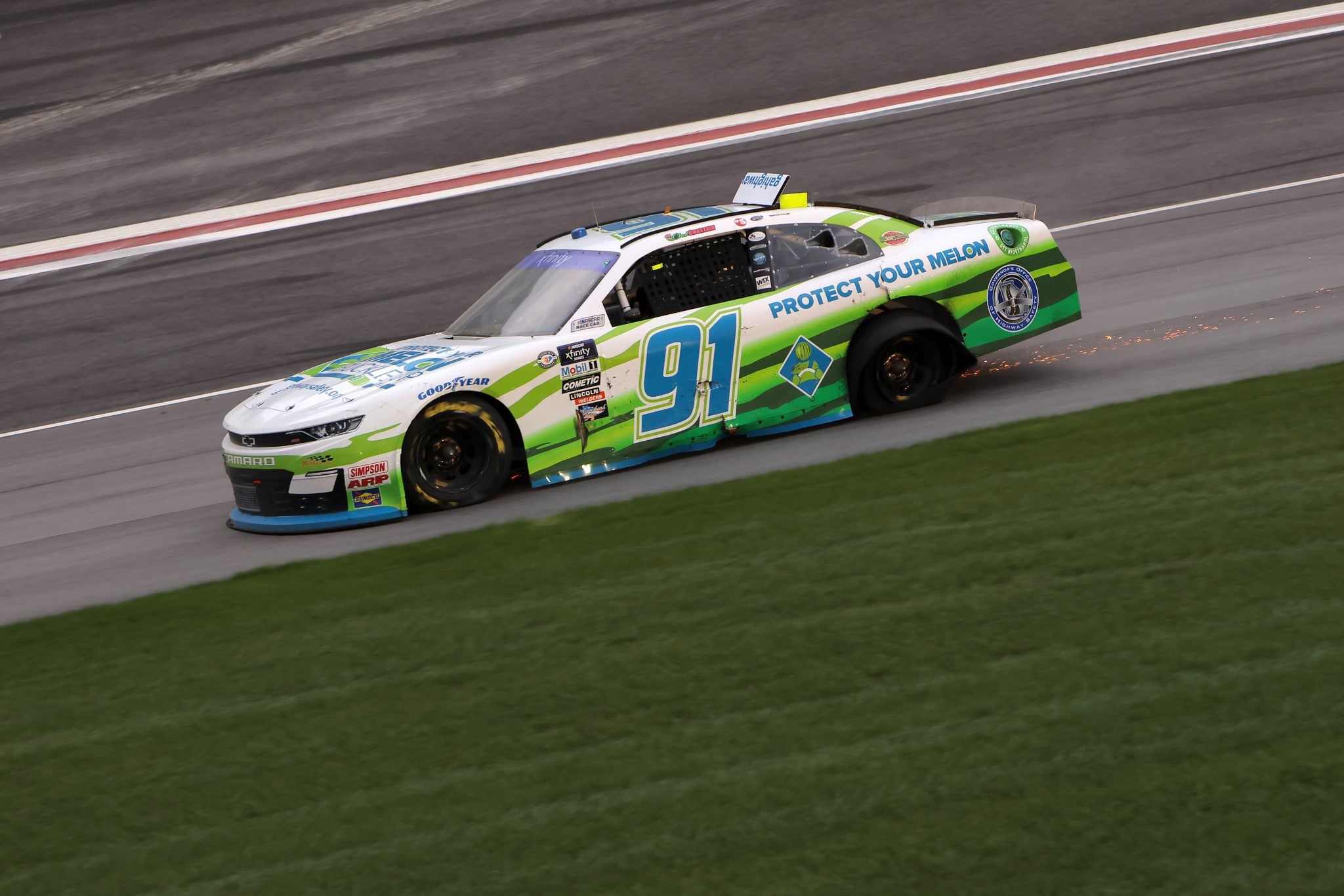 HAMPTON, GEORGIA - MARCH 18: Chad Chastain, driver of the #91 Protect Your Melon Chevrolet, spins with a damaged tire after an on-track incident during the NASCAR Xfinity Series RAPTOR 250 at Atlanta Motor Speedway on March 18, 2023 in Hampton, Georgia. (Photo by Jonathan Bachman/Getty Images) | Getty Images