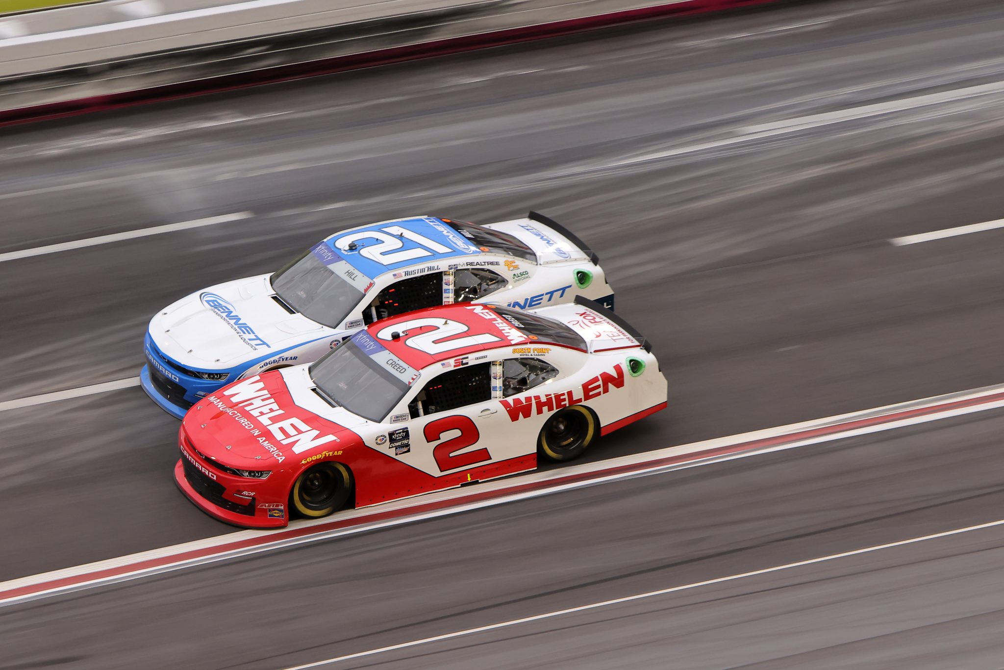 HAMPTON, GEORGIA - MARCH 18: Sheldon Creed, driver of the #2 Whelen Chevrolet, and Austin Hill, driver of the #21 Bennett Transportation Chevrolet, race during the NASCAR Xfinity Series RAPTOR 250 at Atlanta Motor Speedway on March 18, 2023 in Hampton, Georgia. (Photo by Jonathan Bachman/Getty Images) | Getty Images