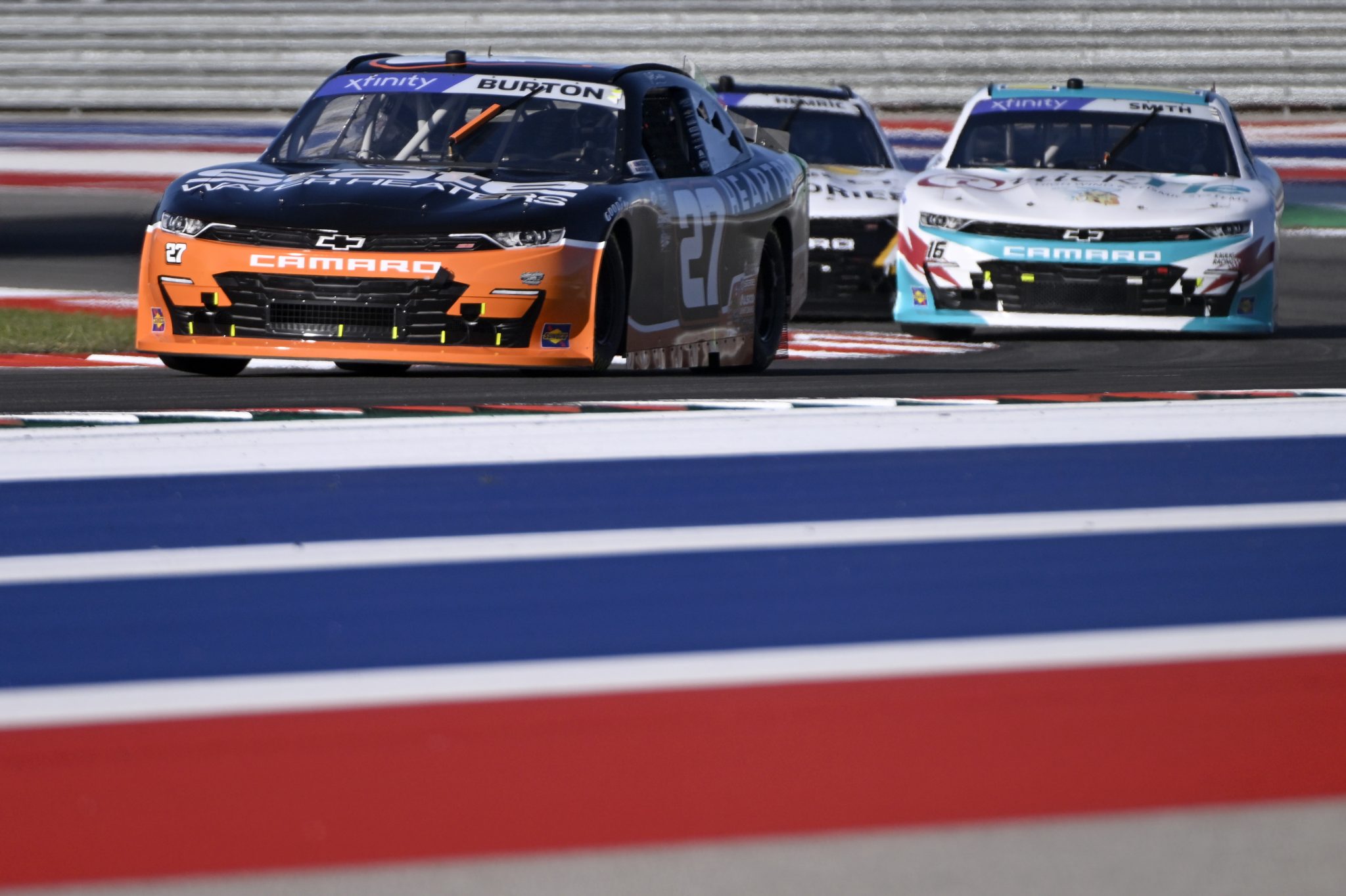 AUSTIN, TEXAS - MARCH 24: Jeb Burton, driver of the #27 State Water Heaters/HeartBeat Chevrolet, and Chandler Smith, driver of the #16 Quick Tie Products Inc. Chevrolet, drive during practice for the NASCAR Xfinity Series Pit Boss 250 at Circuit of The Americas on March 24, 2023 in Austin, Texas. (Photo by Logan Riely/Getty Images) | Getty Images