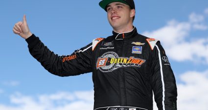 LAS VEGAS, NEVADA - MARCH 04: Blaine Perkins, driver of the #07 AUTOPARKit.com Chevrolet, fives a thumvs up to fans as he walks onstage during driver intros prior to the NASCAR Xfinity Series Alsco Uniforms 300 at Las Vegas Motor Speedway on March 04, 2023 in Las Vegas, Nevada. (Photo by Meg Oliphant/Getty Images) | Getty Images