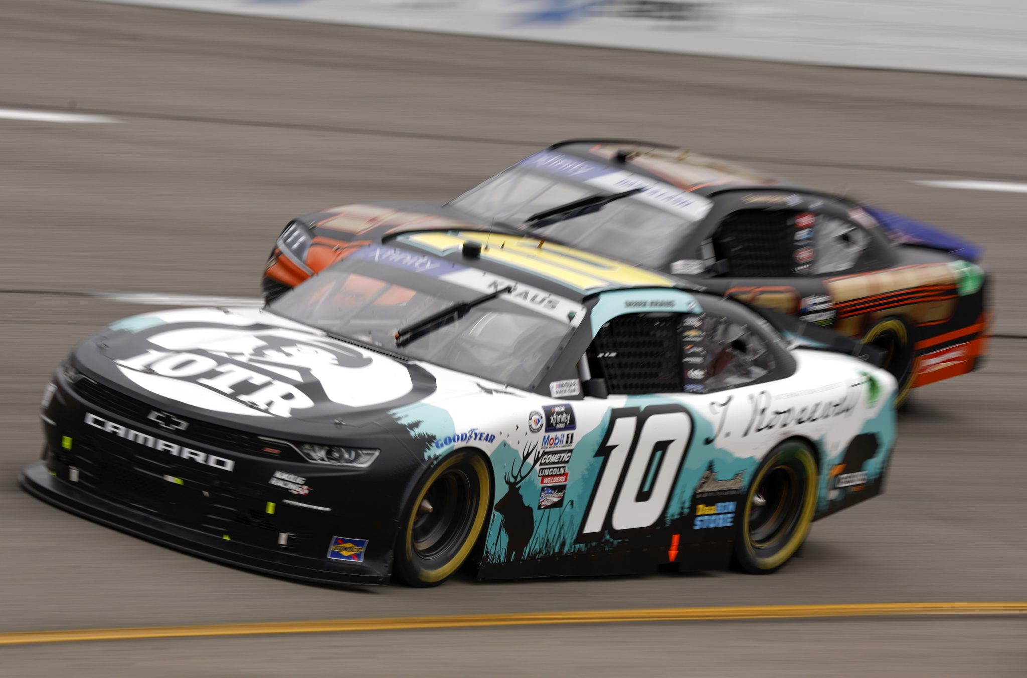 RICHMOND, VIRGINIA - APRIL 01: Derek Kraus, driver of the #10 Intl. Order of T. Roosevelet Chevrolet, and Sammy Smith, driver of the #18 TMC Toyota, race during the NASCAR Xfinity Series ToyotaCare 250 at Richmond Raceway on April 01, 2023 in Richmond, Virginia. (Photo by Jared C. Tilton/Getty Images) | Getty Images