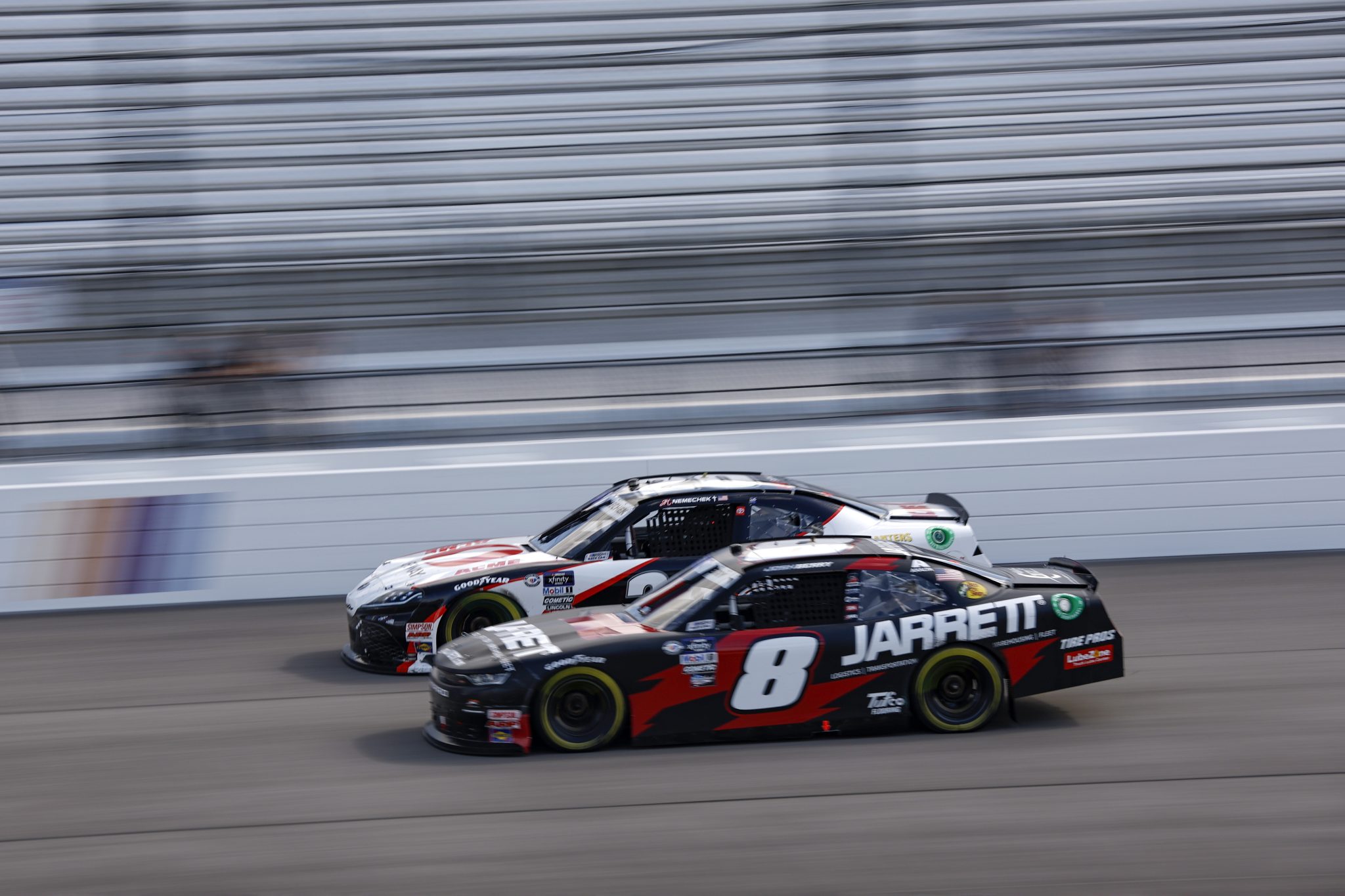 RICHMOND, VIRGINIA - APRIL 01: John Hunter Nemechek, driver of the #20 Safeway/ACME Toyota, and Josh Berry, driver of the #8 Jarrett Logistics Systems Chevrolet, race during the NASCAR Xfinity Series ToyotaCare 250 at Richmond Raceway on April 01, 2023 in Richmond, Virginia. (Photo by Jared C. Tilton/Getty Images) | Getty Images