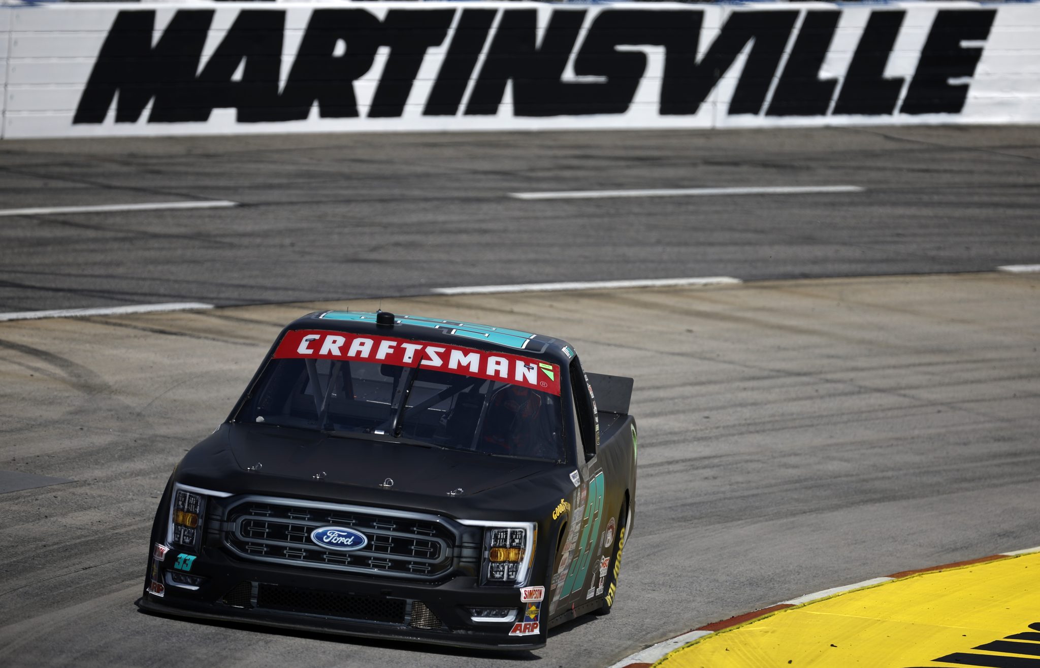 MARTINSVILLE, VIRGINIA - APRIL 14: Mason Massey, driver of the #33 Colonial Countertops Ford, drives during practice NASCAR Craftsman Truck Series Long John Silver's 200 at Martinsville Speedway on April 14, 2023 in Martinsville, Virginia. (Photo by Jared C. Tilton/Getty Images) | Getty Images