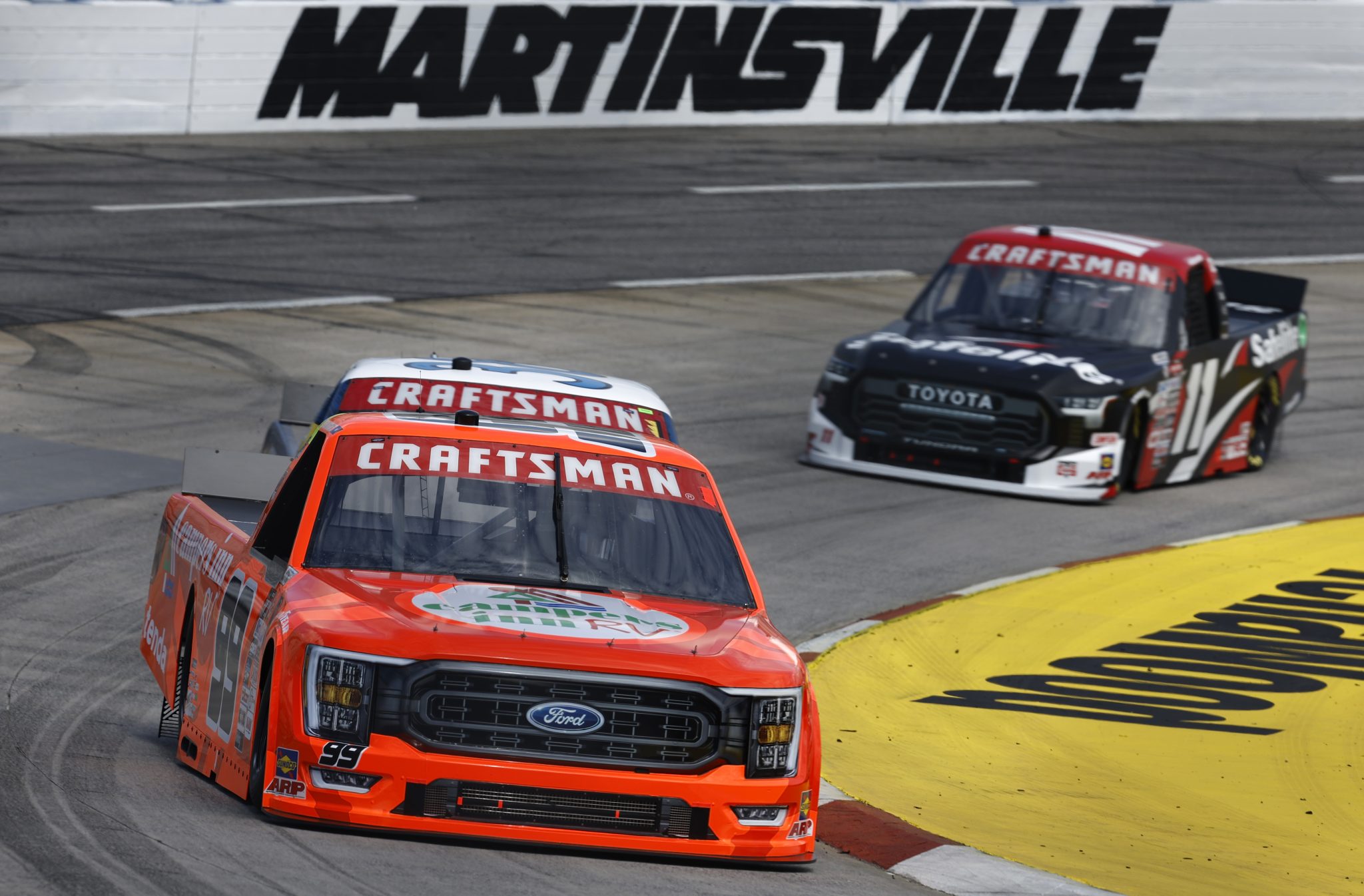 MARTINSVILLE, VIRGINIA - APRIL 14: Ben Rhodes, driver of the #99 Campers Inn RV Ford, and Corey Heim, driver of the #11 Safelite Toyota, drive during practice for the NASCAR Craftsman Truck Series Long John Silver's 200 at Martinsville Speedway on April 14, 2023 in Martinsville, Virginia. (Photo by Jared C. Tilton/Getty Images) | Getty Images