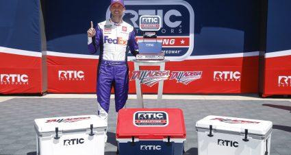 TALLADEGA, ALABAMA - APRIL 22: Denny Hamlin, driver of the #11 FedEx Freight Direct Toyota, poses for photos with the RTIC Outdoors qualifying trophy in victory lane during qualifying for the NASCAR Cup Series GEICO 500 at Talladega Superspeedway on April 22, 2023 in Talladega, Alabama. (Photo by Sean Gardner/Getty Images) | Getty Images