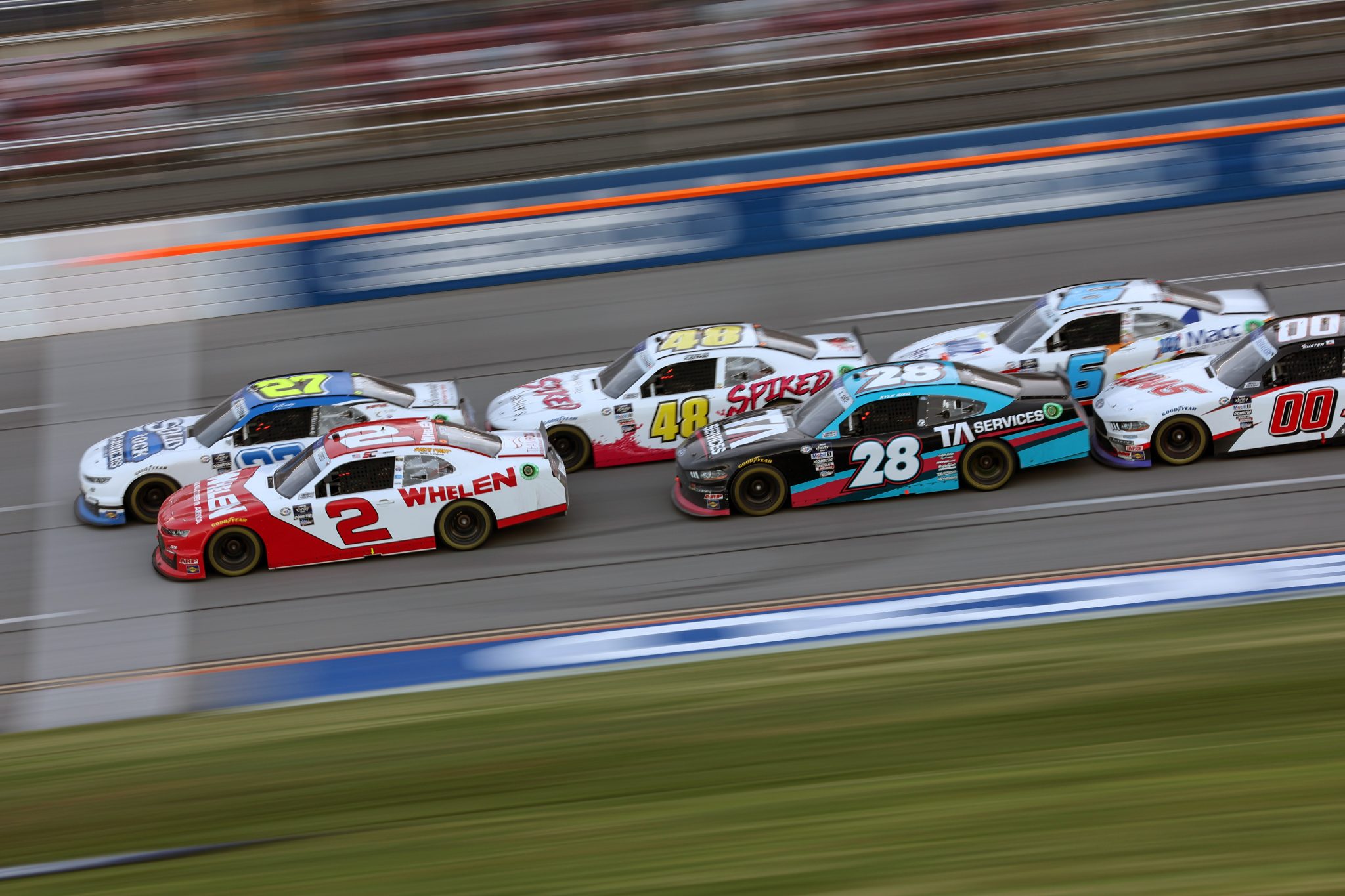 TALLADEGA, ALABAMA - APRIL 22: Jeb Burton, driver of the #27 Solid Rock Carriers Chevrolet, and Sheldon Creed, driver of the #2 Whelen Chevrolet, race during the NASCAR Xfinity Series Ag-Pro 300 at Talladega Superspeedway on April 22, 2023 in Talladega, Alabama. (Photo by James Gilbert/Getty Images) | Getty Images