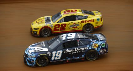 BRISTOL, TENNESSEE - APRIL 08: Martin Truex Jr., driver of the #19 Auto-Owners Insurance Toyota, and Joey Logano, driver of the #22 Shell Pennzoil Ford, race during qualifying heat #4 for the NASCAR Cup Series Food City Dirt Race on Dirt at Bristol Motor Speedway on April 08, 2023 in Bristol, Tennessee. (Photo by Jared C. Tilton/Getty Images) | Getty Images