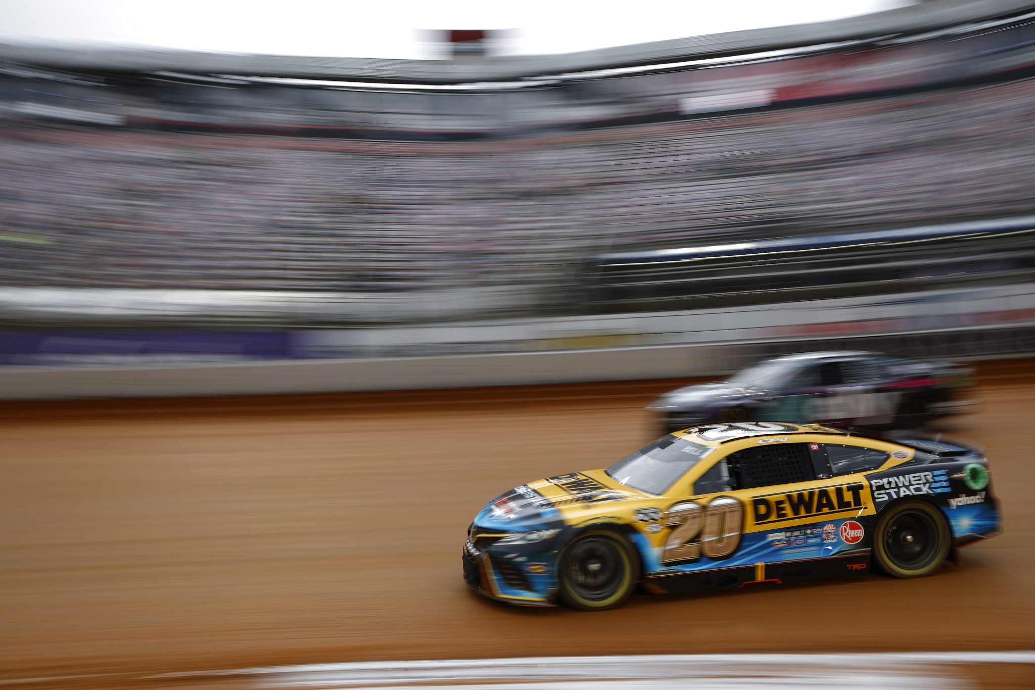 BRISTOL, TENNESSEE - APRIL 08: Christopher Bell, driver of the #20 DeWalt Power Stack Toyota, drives during qualifying heat #1 for the NASCAR Cup Series Food City Dirt Race on Dirt at Bristol Motor Speedway on April 08, 2023 in Bristol, Tennessee. (Photo by Jared C. Tilton/Getty Images) | Getty Images