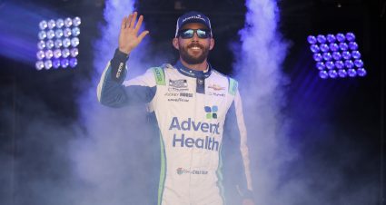 BRISTOL, TENNESSEE - APRIL 09: Ross Chastain, driver of the #1 AdventHealth Chevrolet, waves to fans as he walks onstage during driver intros prior to the NASCAR Cup Series Food City Dirt Race at Bristol Motor Speedway on April 09, 2023 in Bristol, Tennessee. (Photo by Jared C. Tilton/Getty Images) | Getty Images