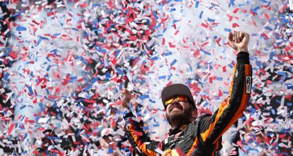 DOVER, DELAWARE - MAY 01: Martin Truex Jr., driver of the #19 Bass Pro Shops Toyota, celebrates in victory lane after winning the NASCAR Cup Series Würth 400 at Dover International Speedway on May 01, 2023 in Dover, Delaware. (Photo by James Gilbert/Getty Images) | Getty Images