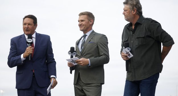 FORT WORTH, TEXAS - MAY 22: (L-R) NASCAR Fox Sports broadcasters Chris Myers, and  Clint Bowyer and singer and television personality Blake Shelton introduce driver during pre-race ceremonies prior to the NASCAR Cup Series All-Star Race at Texas Motor Speedway on May 22, 2022 in Fort Worth, Texas. (Photo by Chris Graythen/Getty Images) | Getty Images