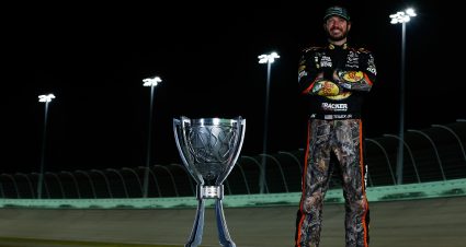 HOMESTEAD, FL - NOVEMBER 19:  Martin Truex Jr., driver of the #78 Bass Pro Shops/Tracker Boats Toyota, poses with the Monster Energy NASCAR Cup Series championship trophy after winning the Ford EcoBoost 400 at Homestead-Miami Speedway on November 19, 2017 in Homestead, Florida.  (Photo by Jonathan Ferrey/Getty Images) | Getty Images