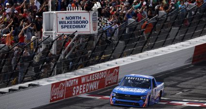 NORTH WILKESBORO, NORTH CAROLINA - MAY 20: Kyle Larson, driver of the #7 HendrickCars.com Chevrolet, takes the checkered flag to win the NASCAR Craftsman Truck Series Tyson 250 at North Wilkesboro Speedway on May 20, 2023 in North Wilkesboro, North Carolina. (Photo by Jared C. Tilton/Getty Images) | Getty Images