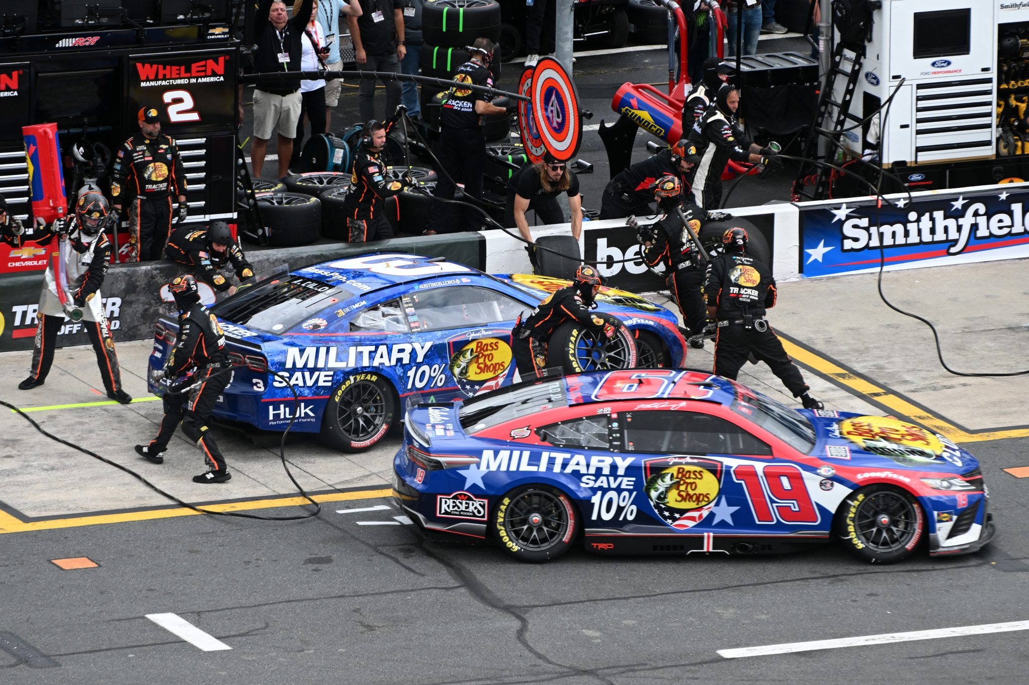 CONCORD, NORTH CAROLINA - MAY 29: Martin Truex Jr., driver of the #19 Bass Pro Shops Toyota, exits pit road as Austin Dillon, driver of the #3 Bass Pro Shops Chevrolet, pits during the NASCAR Cup Series Coca-Cola 600 at Charlotte Motor Speedway on May 29, 2023 in Concord, North Carolina. (Photo by Logan Riely/Getty Images) | Getty Images