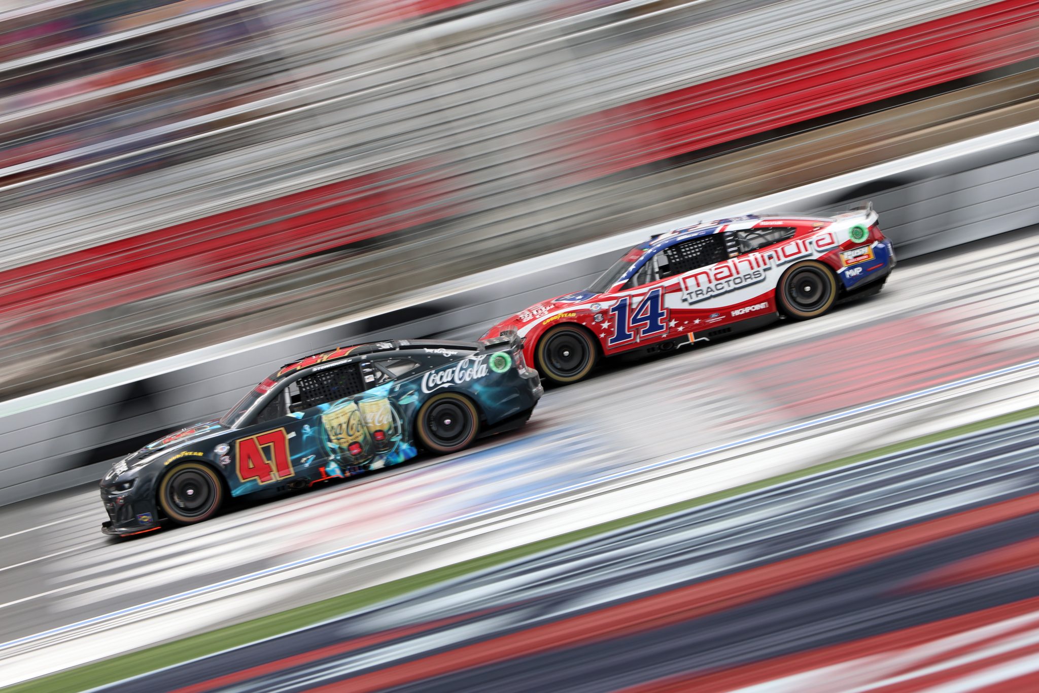 CONCORD, NORTH CAROLINA - MAY 29: Ricky Stenhouse Jr., driver of the #47 Kroger/Coca-Cola Chevrolet, and Chase Briscoe, driver of the #14 Mahindra Tractors Ford, race during the NASCAR Cup Series Coca-Cola 600 at Charlotte Motor Speedway on May 29, 2023 in Concord, North Carolina. (Photo by David Jensen/Getty Images) | Getty Images