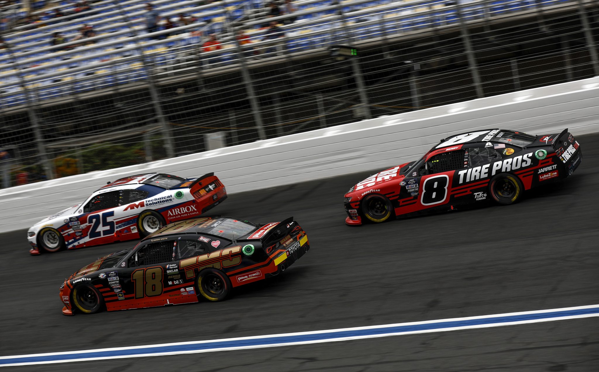 CONCORD, NORTH CAROLINA - MAY 29: Sammy Smith, driver of the #18 TMC Toyota, Brett Moffitt, driver of the #25 American Heroes Ford, and Josh Berry, driver of the #8 Tire Pros Love The Drive Chevrolet, race during the NASCAR Xfinity Series Alsco Uniforms 300 at Charlotte Motor Speedway on May 29, 2023 in Concord, North Carolina. (Photo by Jared C. Tilton/Getty Images) | Getty Images