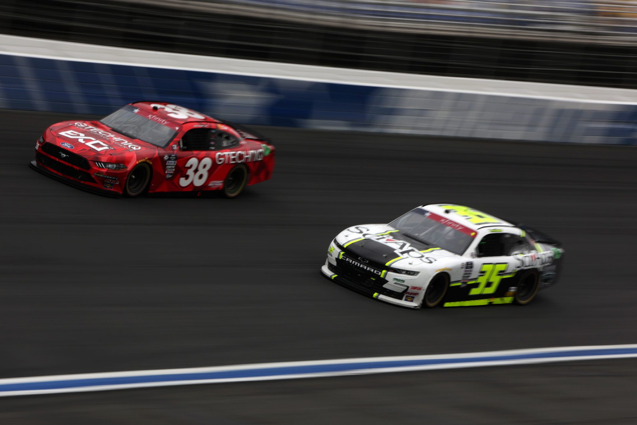 CONCORD, NORTH CAROLINA - MAY 29: Joe Graf Jr., driver of the #38 GTECHNIQ Ford, and Patrick Emerling, driver of the #35 Adkins Automotive Chevrolet, race during the NASCAR Xfinity Series Alsco Uniforms 300 at Charlotte Motor Speedway on May 29, 2023 in Concord, North Carolina. (Photo by Keenan Hairston/Getty Images)
