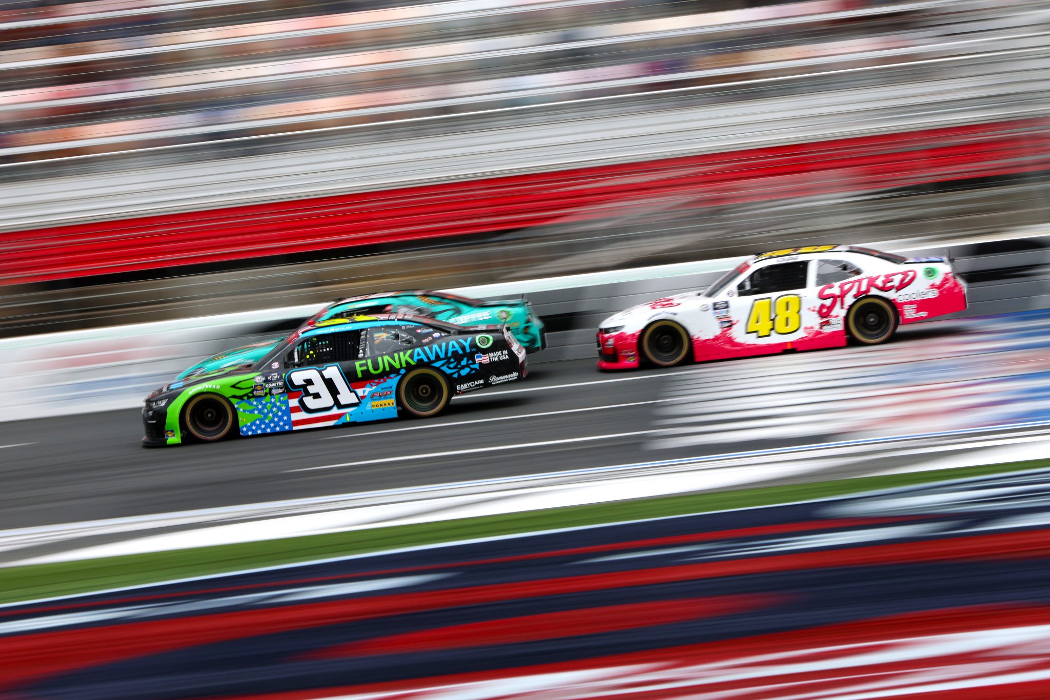 CONCORD, NORTH CAROLINA - MAY 29: Parker Retzlaff, driver of the #31 FUNKAWAY Chevrolet, and Parker Kligerman, driver of the #48 Big Machine Racing Spiked Chevrolet, race during the NASCAR Xfinity Series Alsco Uniforms 300 at Charlotte Motor Speedway on May 29, 2023 in Concord, North Carolina. (Photo by David Jensen/Getty Images) | Getty Images