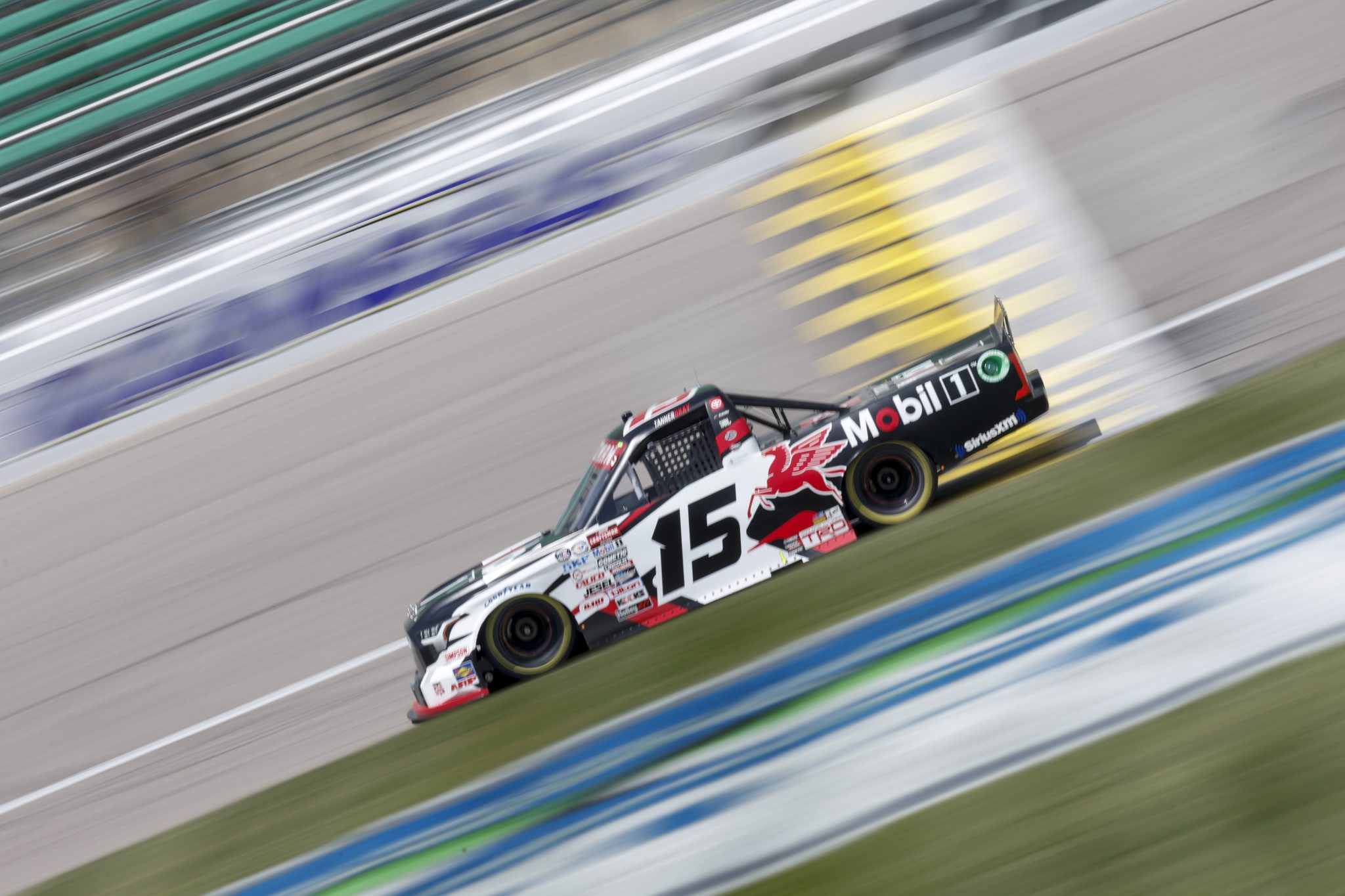 KANSAS CITY, KANSAS - MAY 06: Tanner Gray, driver of the #15 Mobi 1 Toyota drives during qualifying for the NASCAR Craftsman Truck Series Heart of America 200 at Kansas Speedway on May 06, 2023 in Kansas City, Kansas. (Photo by Sean Gardner/Getty Images) | Getty Images