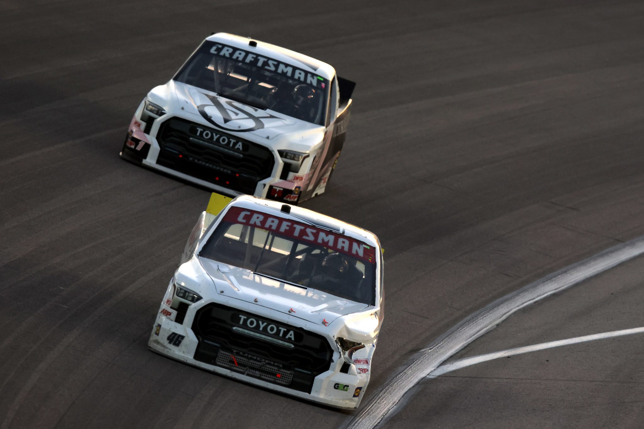 KANSAS CITY, KANSAS - MAY 06: Brennan Poole, driver of the #46 Toyota, and Toni Breidinger, driver of the #1 Victoria's Secret Toyota, race during the NASCAR Craftsman Truck Series Heart of America 200 at Kansas Speedway on May 06, 2023 in Kansas City, Kansas. (Photo by Jonathan Bachman/Getty Images) | Getty Images