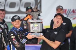 TALLADEGA, ALABAMA - APRIL 22: Jeb Burton, driver of the #27 Solid Rock Carriers Chevrolet, and team owner Jordan Anderson celebrate in victory lane after winning the NASCAR Xfinity Series Ag-Pro 300 at Talladega Superspeedway on April 22, 2023 in Talladega, Alabama. (Photo by James Gilbert/Getty Images) | Getty Images