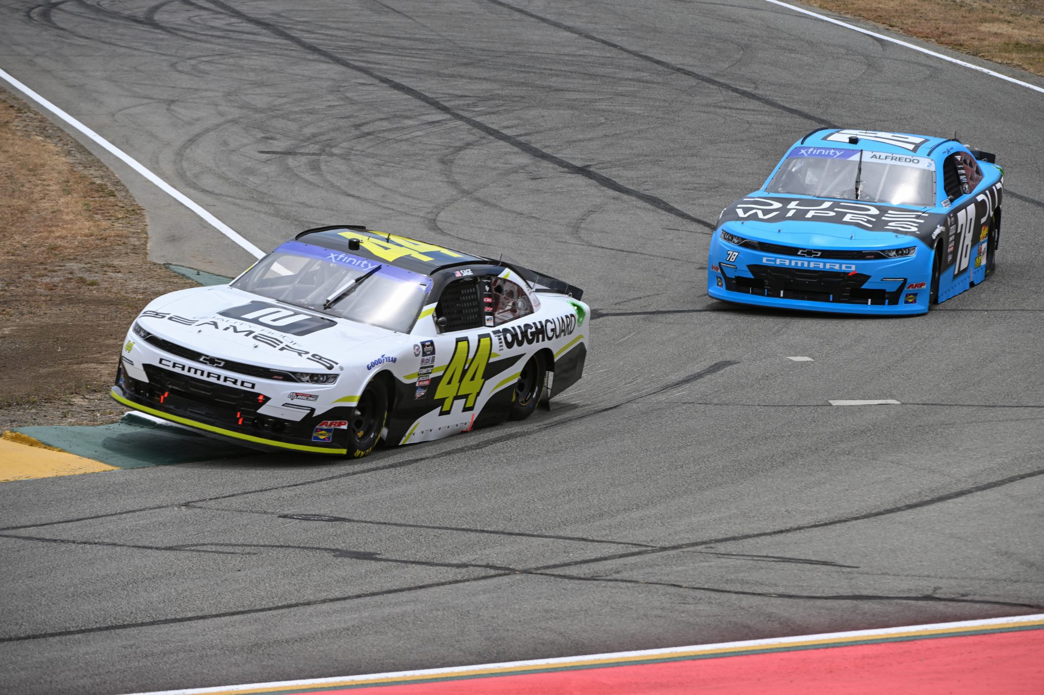 SONOMA, CALIFORNIA - JUNE 09: Sage Karam, driver of the #44 Quality Roof Seamers/ToughGuard Chevrolet, and Anthony Alfredo, driver of the #78 DUDE Wipes Chevrolet, drive during practice for the NASCAR Xfinity Series DoorDash 250 at Sonoma Raceway on June 09, 2023 in Sonoma, California. (Photo by Logan Riely/Getty Images) | Getty Images