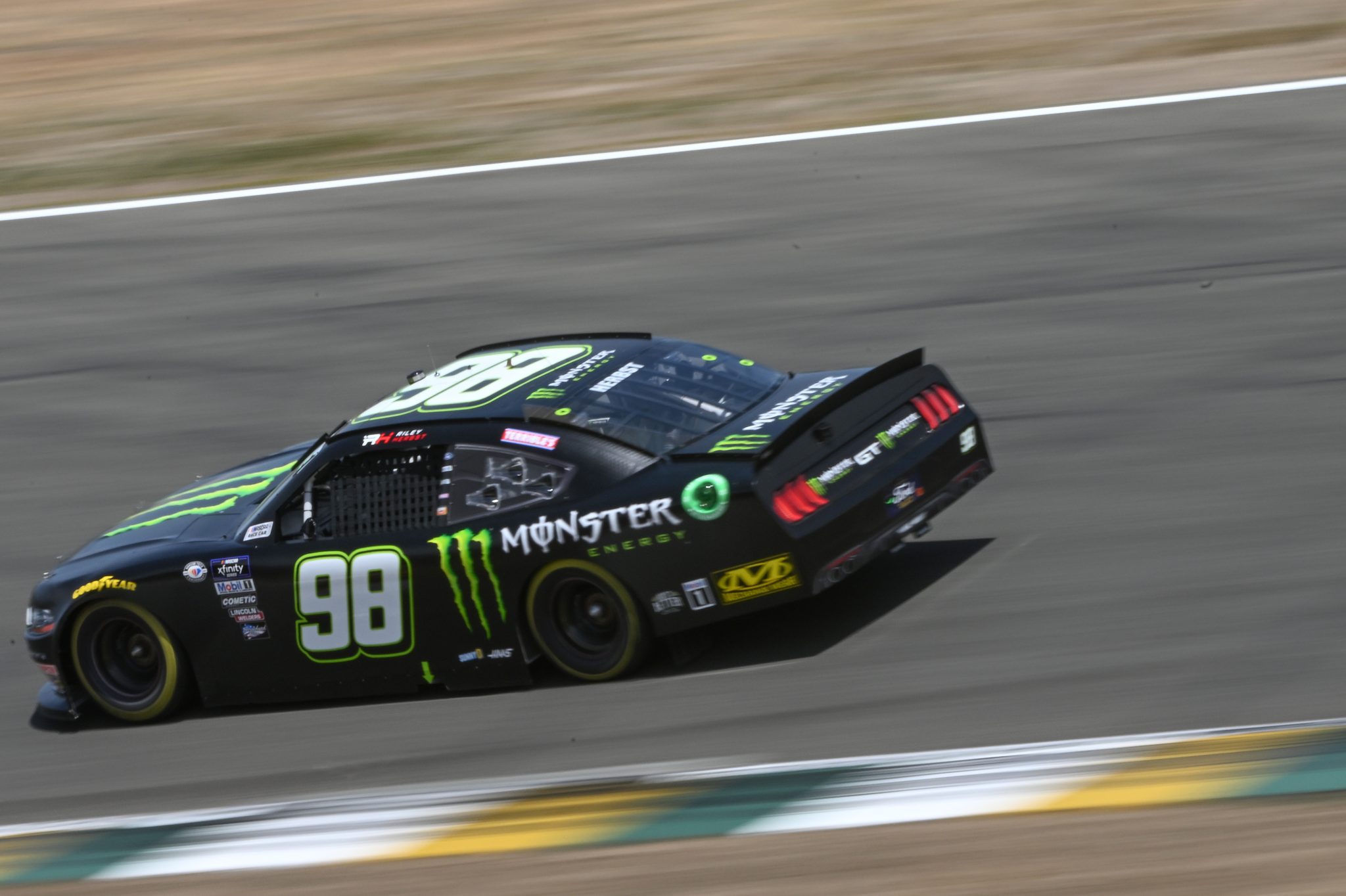 SONOMA, CALIFORNIA - JUNE 10: Riley Herbst, driver of the #98 Monster Energy Ford, drives during qualifying for the NASCAR Xfinity Series DoorDash 250 at Sonoma Raceway on June 10, 2023 in Sonoma, California. (Photo by Logan Riely/Getty Images) | Getty Images