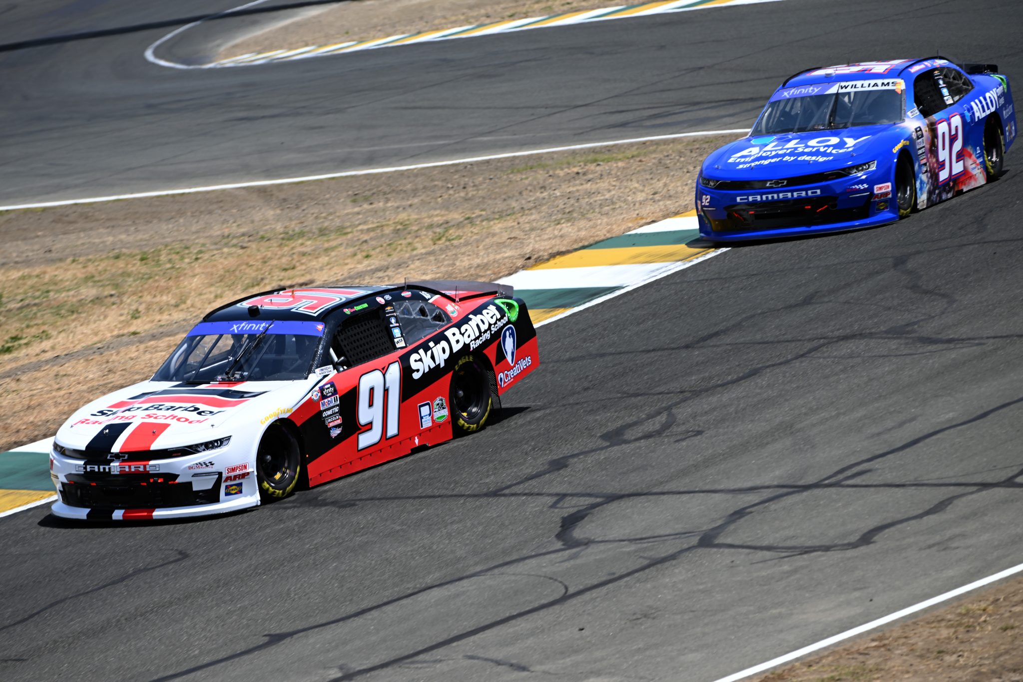 SONOMA, CALIFORNIA - JUNE 10: Ross Chastain, driver of the #91 Skip Barber Racing School Chevrolet, and Josh Williams, driver of the #92 Alloy Employer Services Chevrolet, drive during qualifying for the NASCAR Xfinity Series DoorDash 250 at Sonoma Raceway on June 10, 2023 in Sonoma, California. (Photo by Logan Riely/Getty Images) | Getty Images