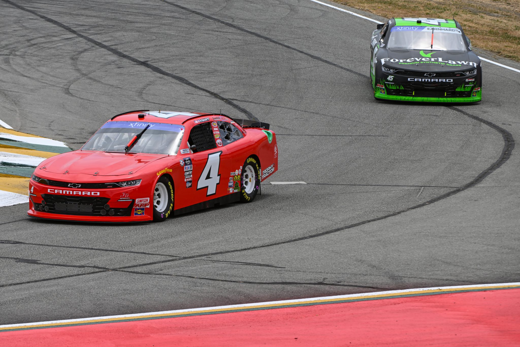 SONOMA, CALIFORNIA - JUNE 09: Ty Dillon, driver of the #4 Chevrolet, and Jeffrey Earnhardt, driver of the #45 ForeverLawn Chevrolet, drive during practice for the NASCAR Xfinity Series DoorDash 250 at Sonoma Raceway on June 09, 2023 in Sonoma, California. (Photo by Logan Riely/Getty Images) | Getty Images