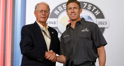 DARLINGTON, SOUTH CAROLINA - MAY 14: NASCAR Chairman and CEO Jim France (L) congratulates former NASCAR Series Cup driver Carl Edwards on selection to NASCAR's 75 Greatest Drivers list prior to the NASCAR Cup Series Goodyear 400 at Darlington Raceway on May 14, 2023 in Darlington, South Carolina. (Photo by Jared C. Tilton/Getty Images) | Getty Images