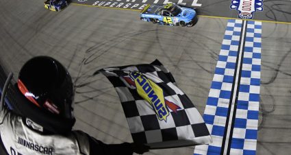LEBANON, TENNESSEE - JUNE 23: Carson Hocevar, driver of the #42 Worldwide Express Chevrolet, takes the checkered flag to win the NASCAR Craftsman Truck Series Rackley Roofing 200 at Nashville Superspeedway on June 23, 2023 in Lebanon, Tennessee. (Photo by Logan Riely/Getty Images) | Getty Images