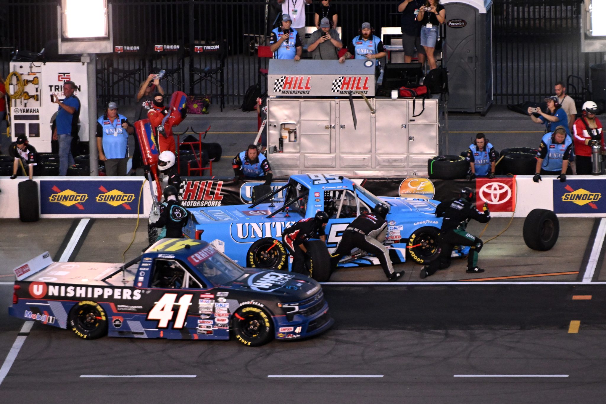 LEBANON, TENNESSEE - JUNE 23: Dean Thompson, driver of the #5 Thompson Pipe Group Toyota, pits as Bayley Currey, driver of the #41 Unishippers Chevrolet, exits pit road during the NASCAR Craftsman Truck Series Rackley Roofing 200 at Nashville Superspeedway on June 23, 2023 in Lebanon, Tennessee. (Photo by Logan Riely/Getty Images) | Getty Images