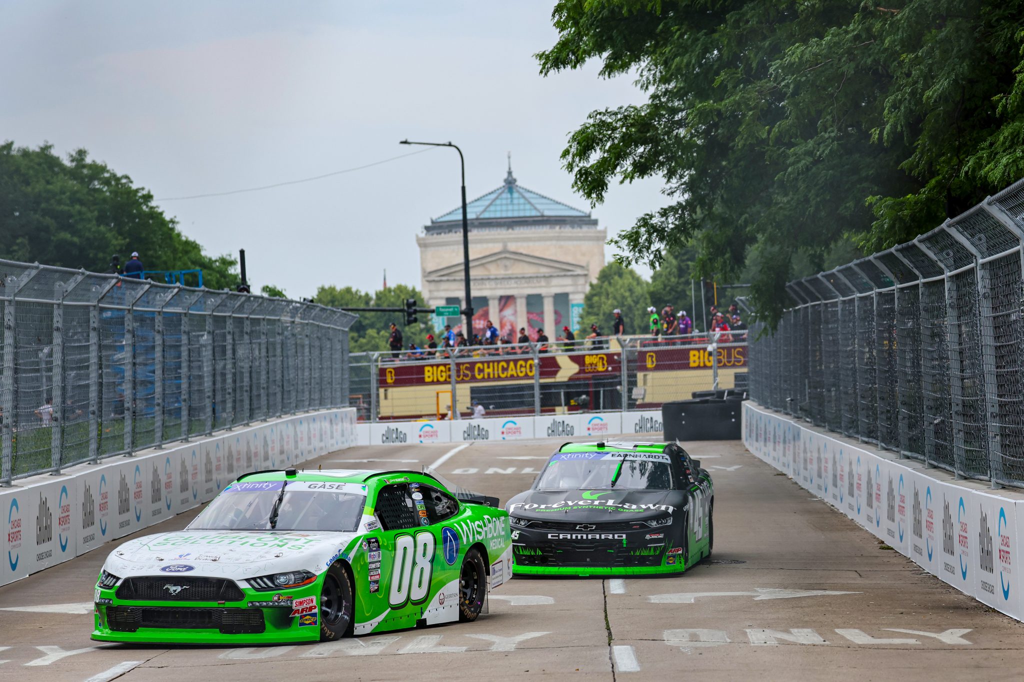 CHICAGO, ILLINOIS - JULY 01: Joey Gase, driver of the #08 Clubfoot Solutions Ford, and Jeffrey Earnhardt, driver of the #45 ForeverLawn Chicago Chevrolet, drive during practice for the NASCAR Xfinity Series The Loop 121 at the Chicago Street Course on July 01, 2023 in Chicago, Illinois. (Photo by Michael Reaves/Getty Images) | Getty Images