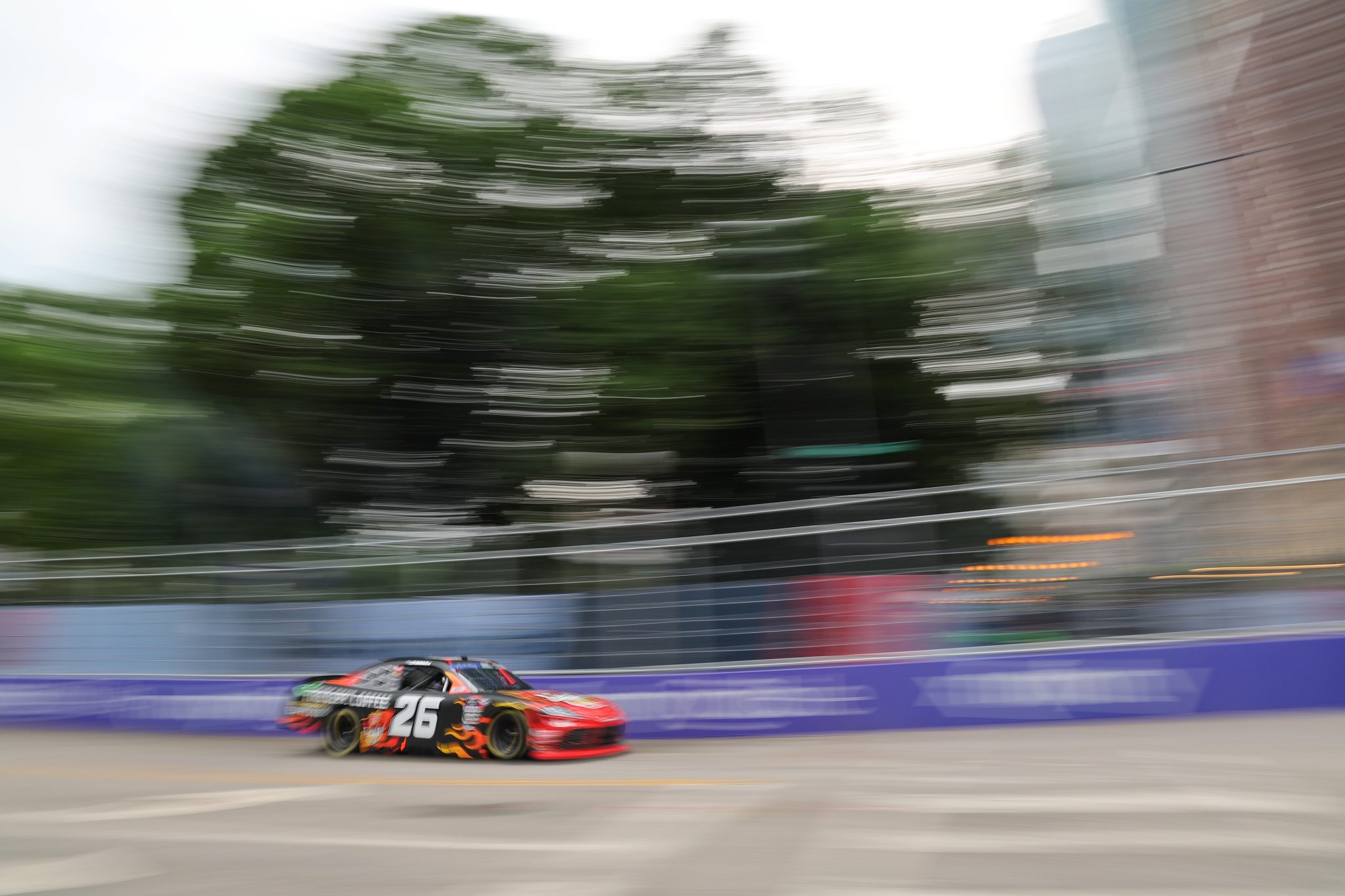 CHICAGO, ILLINOIS - JULY 01: Kaz Grala, driver of the #26 FDC Skull Crushing Espresso Toyota, drives during the NASCAR Xfinity Series The Loop 121 at the Chicago Street Course on July 01, 2023 in Chicago, Illinois. (Photo by Michael Reaves/Getty Images) | Getty Images