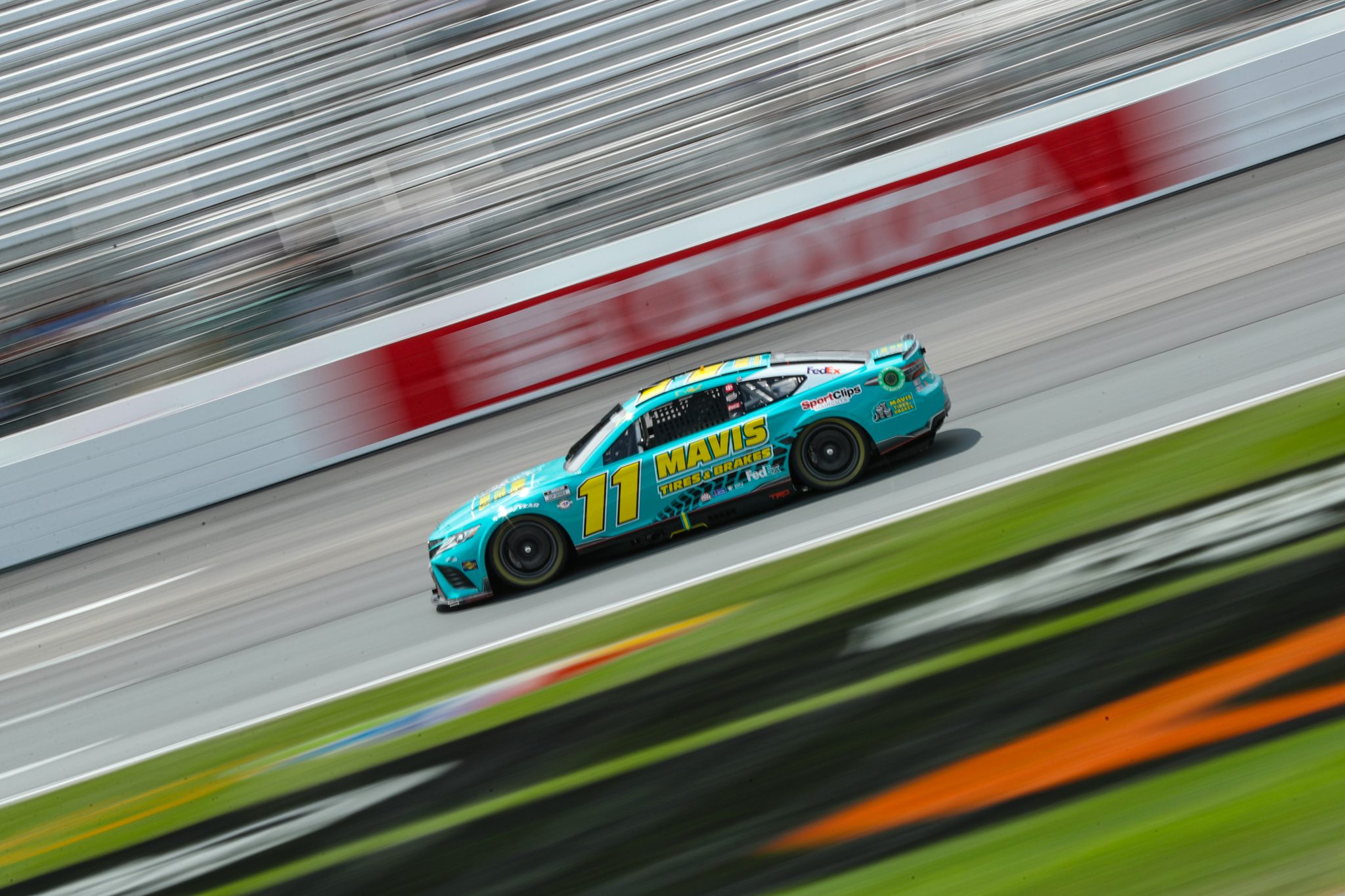 LOUDON, NEW HAMPSHIRE - JULY 15: Denny Hamlin, driver of the #11 Mavis Tires & Brakes Toyota, drives during qualifying for the NASCAR Cup Series Crayon 301 at New Hampshire Motor Speedway on July 15, 2023 in Loudon, New Hampshire. (Photo by Meg Oliphant/Getty Images) | Getty Images