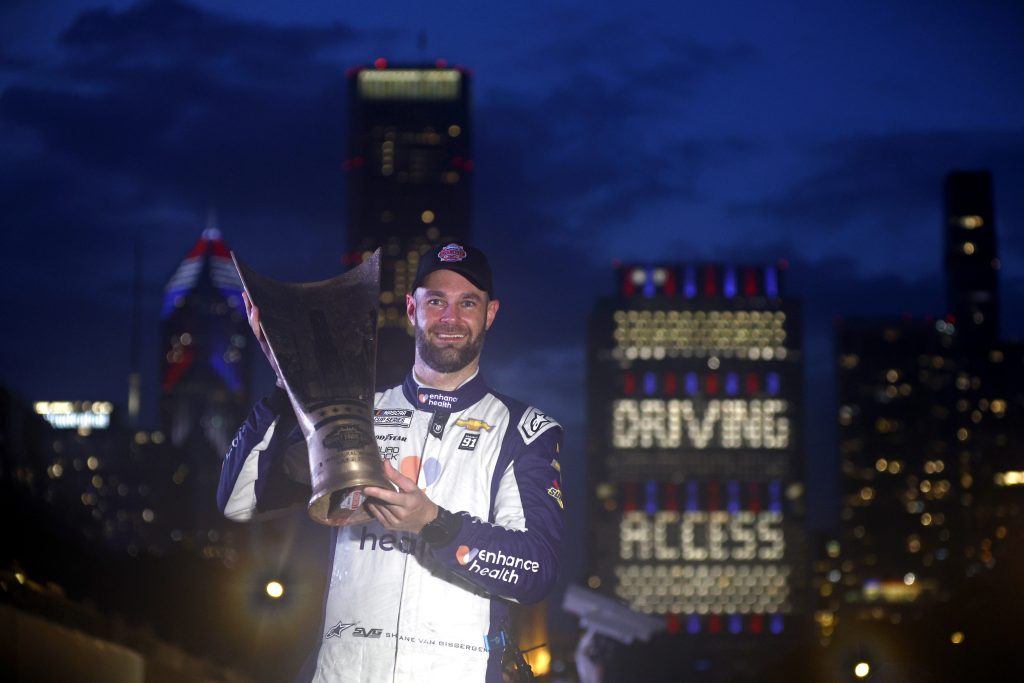 CHICAGO, ILLINOIS - JULY 02: Shane Van Gisbergen, driver of the #91 Enhance Health Chevrolet, lifts the Inaugural Grant Park 220 trophy in the Ruoff Mortgage victory lane after winning the NASCAR Cup Series Grant Park 220 at the Chicago Street Course on July 02, 2023 in Chicago, Illinois. (Photo by Jared C. Tilton/Getty Images) | Getty Images