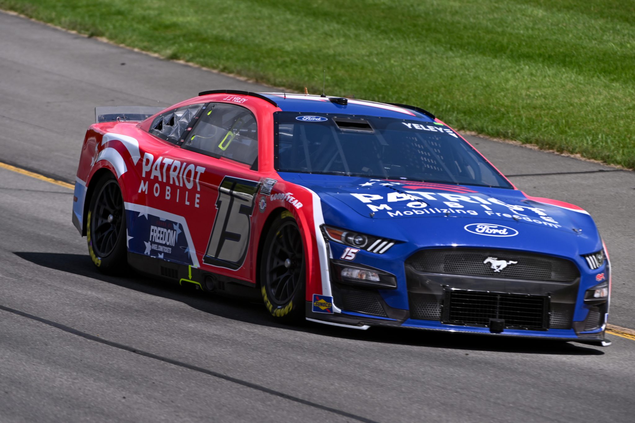 LONG POND, PENNSYLVANIA - JULY 22: JJ Yeley, driver of the #15 Patriot Mobile Ford, drives during practice for the NASCAR Cup Series HighPoint.com 400 at Pocono Raceway on July 22, 2023 in Long Pond, Pennsylvania. (Photo by Logan Riely/Getty Images) | Getty Images